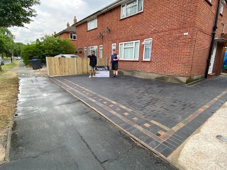 Completed block-paved driveway with Armortec team